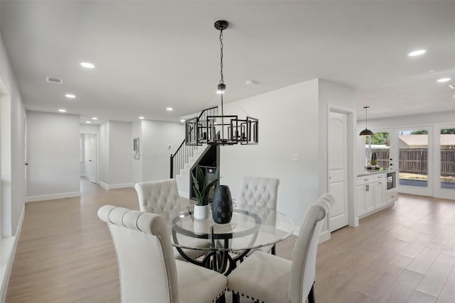 dining room with light wood-type flooring