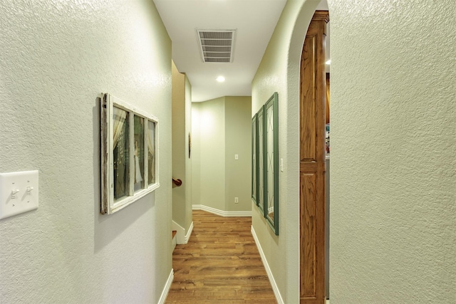 corridor featuring hardwood / wood-style flooring