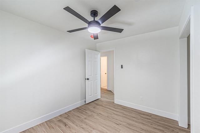 unfurnished bedroom with ceiling fan and light wood-type flooring