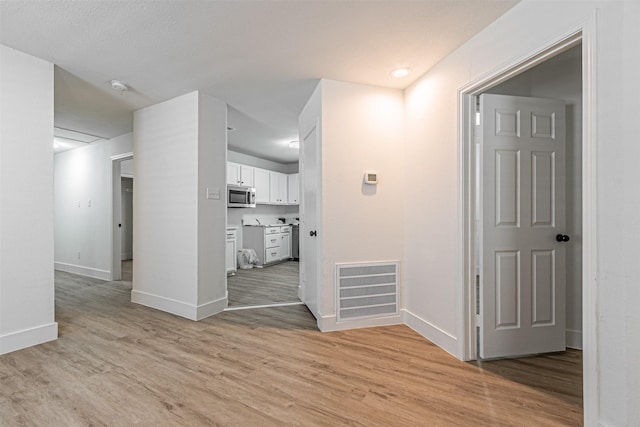 interior space with light hardwood / wood-style flooring