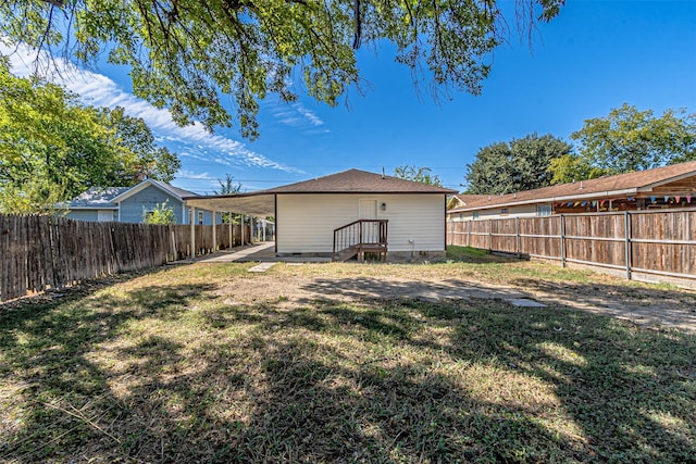 rear view of property with a lawn