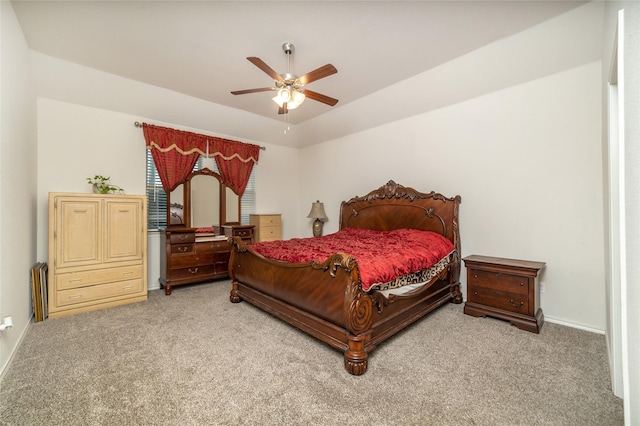 carpeted bedroom featuring a ceiling fan and baseboards