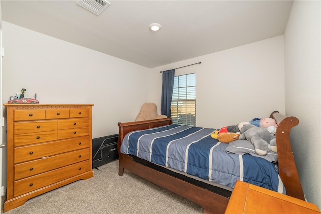 bedroom with light colored carpet and visible vents