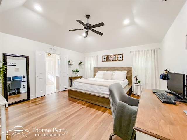 bedroom with lofted ceiling, ceiling fan, and light wood-type flooring