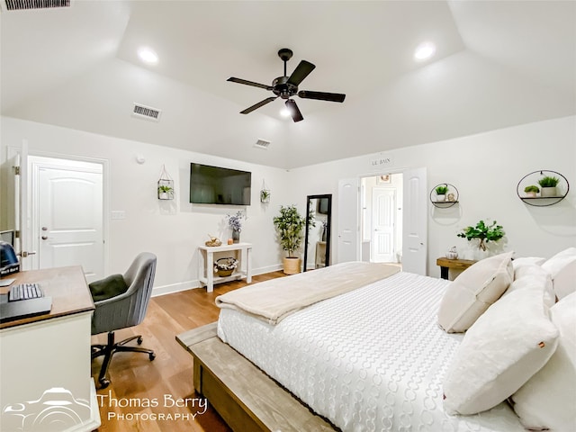 bedroom featuring lofted ceiling, ceiling fan, and light hardwood / wood-style floors