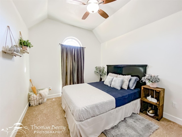 bedroom with light carpet, vaulted ceiling, and ceiling fan