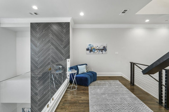 sitting room featuring crown molding and dark hardwood / wood-style floors