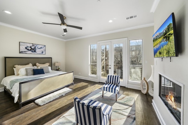 bedroom featuring crown molding, dark hardwood / wood-style flooring, access to exterior, and ceiling fan