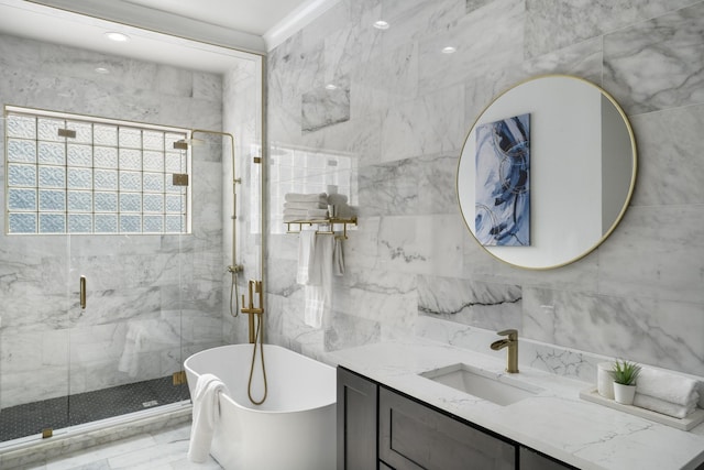 bathroom with independent shower and bath, vanity, and tile walls