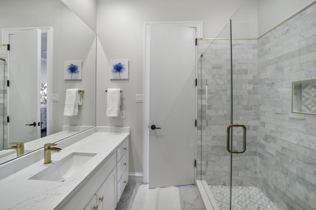 bathroom featuring vanity and an enclosed shower