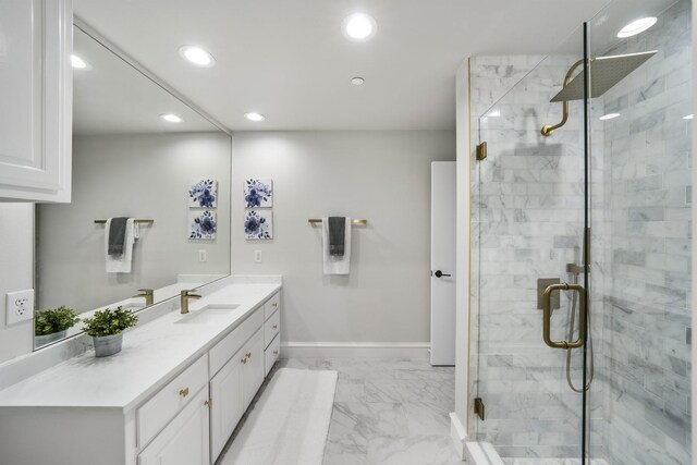 bathroom featuring vanity and an enclosed shower