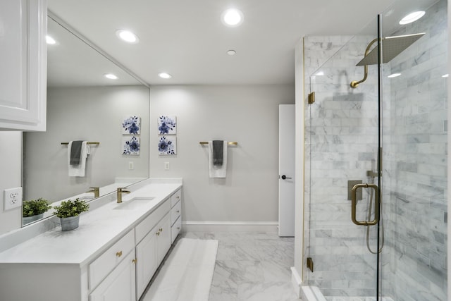 bathroom featuring a shower with shower door and vanity