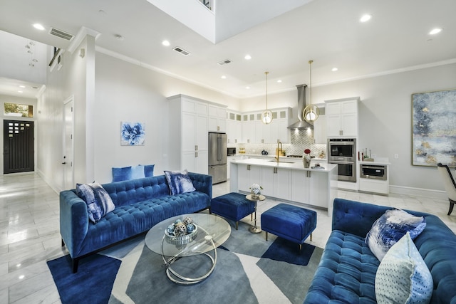 living room with ornamental molding