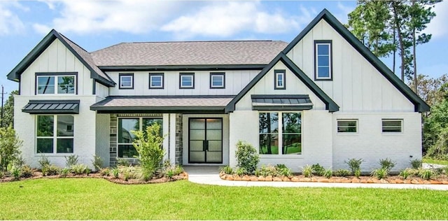 modern farmhouse featuring a front yard