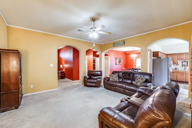 carpeted living room featuring ceiling fan, ornamental molding, and sink