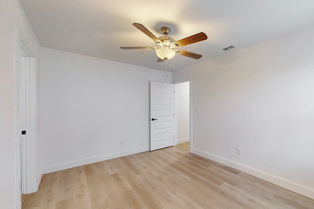 empty room with ceiling fan and light wood-type flooring