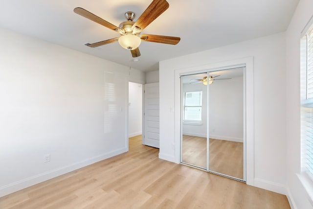 unfurnished bedroom with a closet, ceiling fan, and light hardwood / wood-style flooring