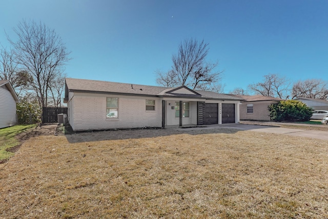 single story home with cooling unit, a garage, and a front lawn