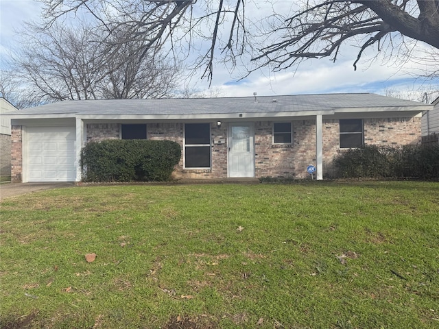 single story home featuring a garage and a front yard