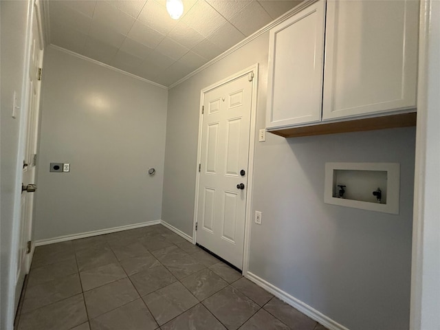 washroom featuring hookup for a washing machine, ornamental molding, hookup for an electric dryer, and cabinets