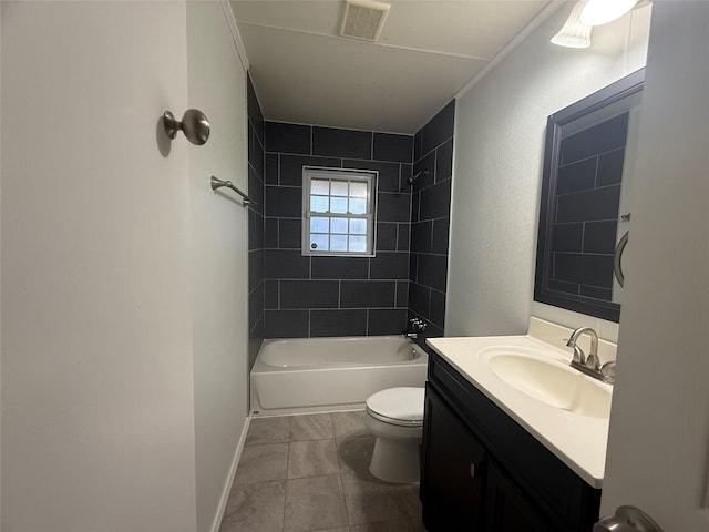 full bathroom with tiled shower / bath, vanity, and toilet