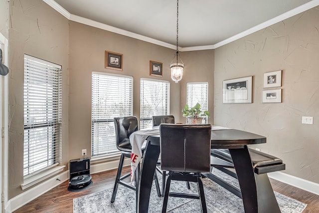 dining space with wood-type flooring and crown molding