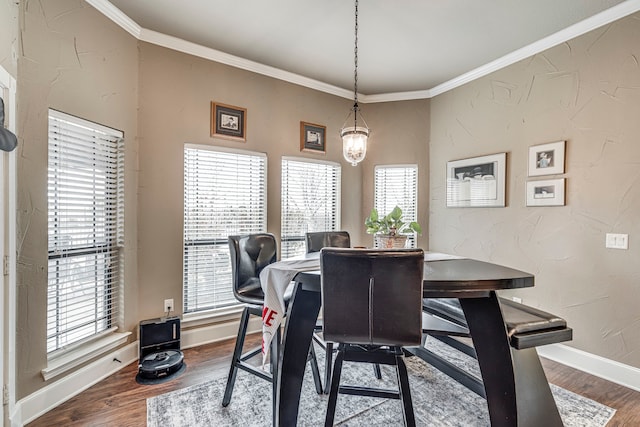 dining room with crown molding, dark wood-style floors, and a wealth of natural light