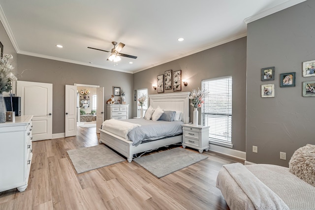 bedroom featuring light wood-type flooring, ceiling fan, and crown molding