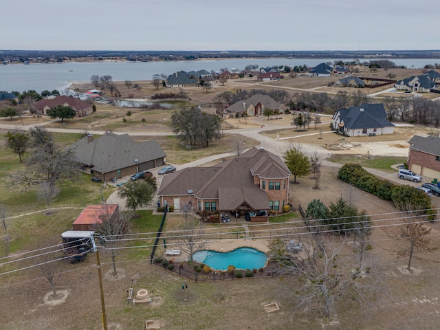 aerial view with a water view and a residential view