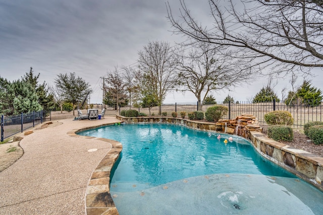 view of swimming pool featuring a patio area and pool water feature