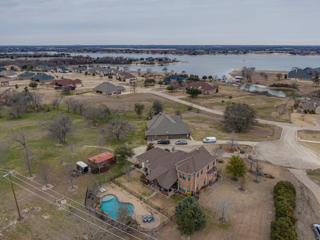 drone / aerial view with a residential view and a water view