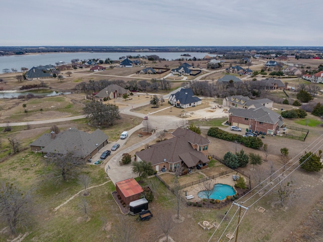 aerial view with a residential view and a water view