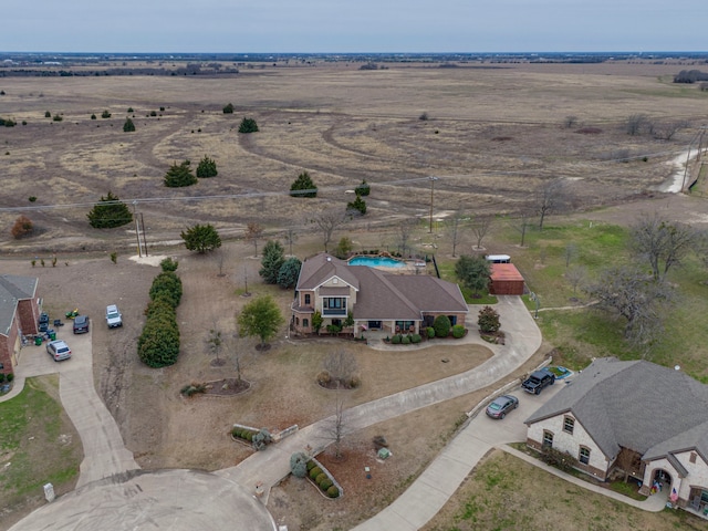 birds eye view of property with a rural view