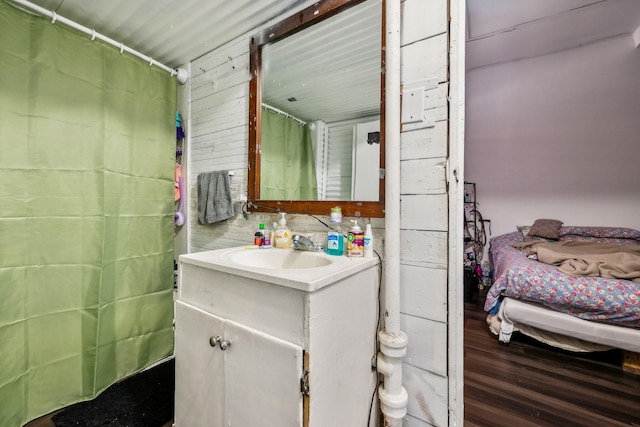 bathroom featuring hardwood / wood-style flooring and vanity