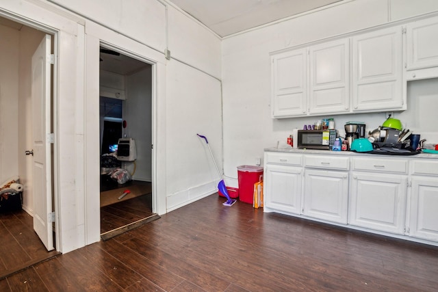 kitchen featuring white cabinets and dark hardwood / wood-style flooring