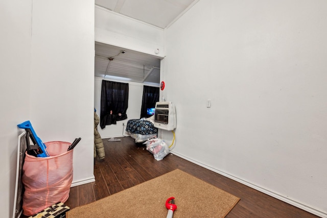 hall with heating unit and dark hardwood / wood-style flooring