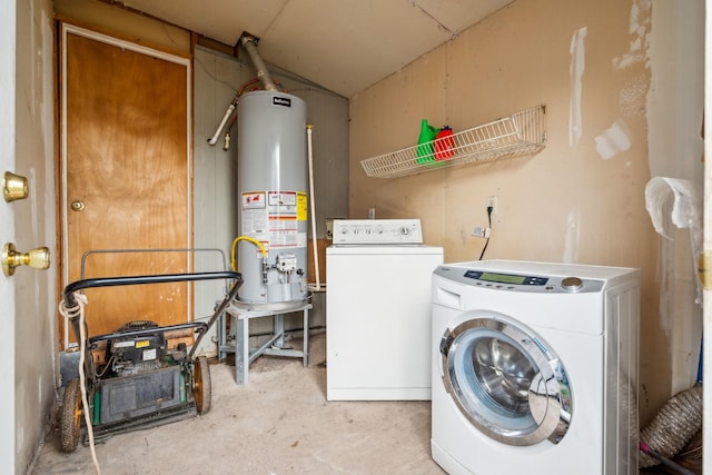 laundry area with washing machine and dryer and water heater