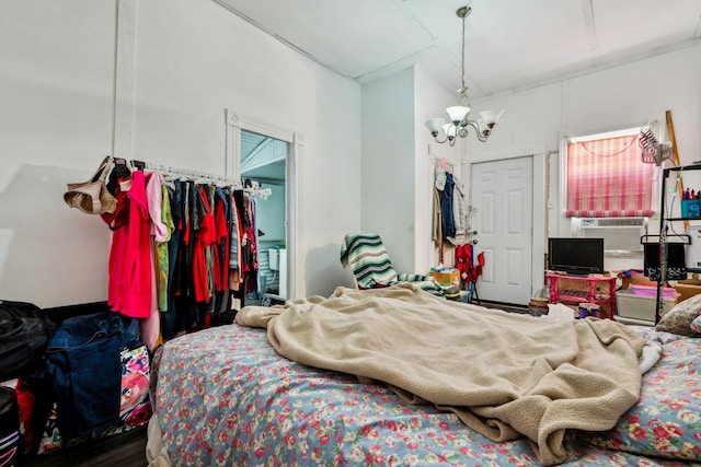 bedroom featuring an inviting chandelier