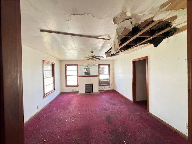 unfurnished living room with carpet floors, cooling unit, and ceiling fan