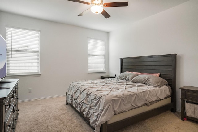 bedroom featuring ceiling fan and light colored carpet