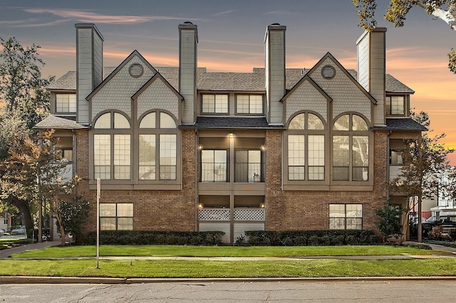 view of outdoor building at dusk