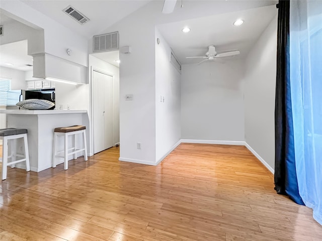 spare room featuring light hardwood / wood-style floors and ceiling fan