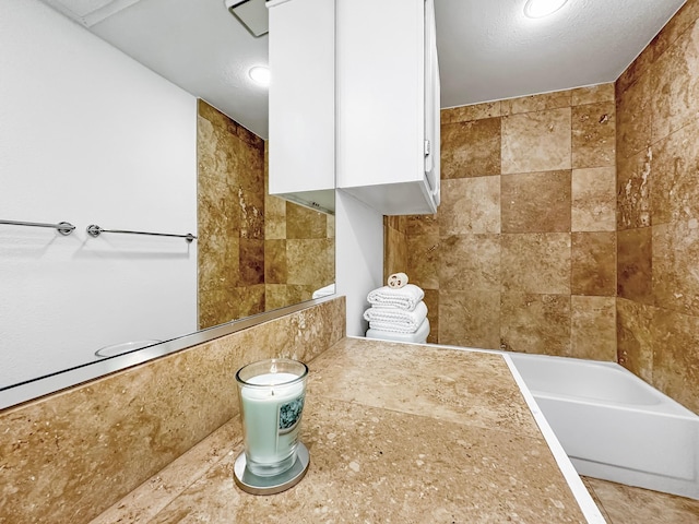 bathroom featuring tile walls