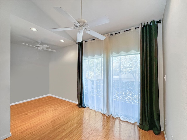 empty room with hardwood / wood-style flooring