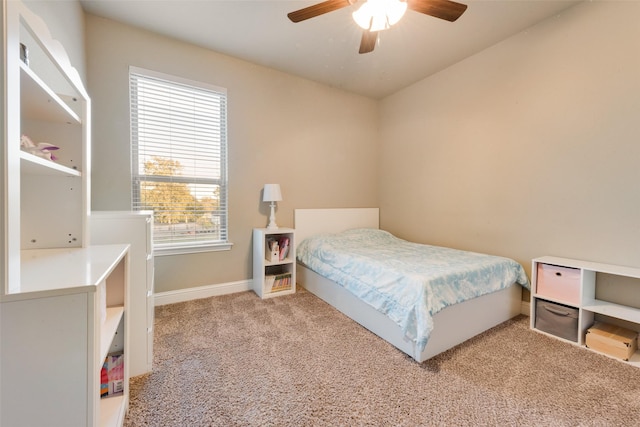 bedroom featuring carpet floors, a ceiling fan, and baseboards