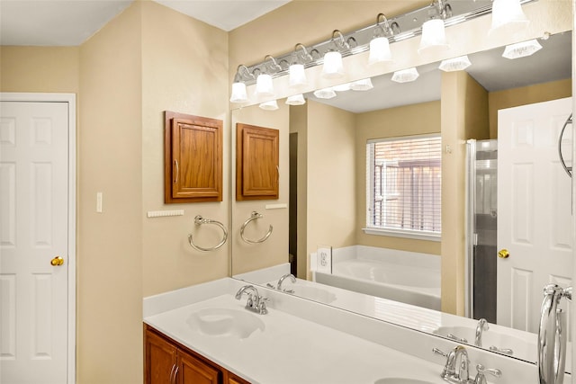 bathroom featuring a washtub and vanity