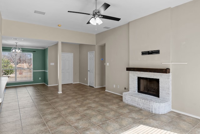 unfurnished living room featuring ceiling fan with notable chandelier and a brick fireplace