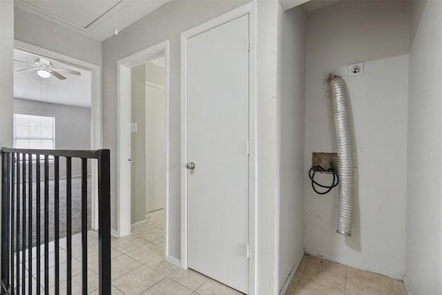 corridor featuring light tile patterned floors