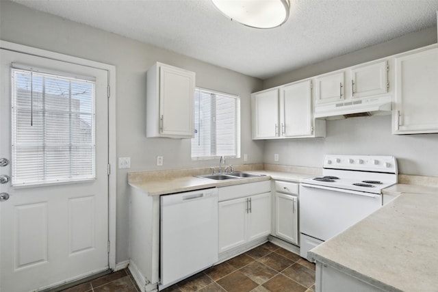 kitchen featuring plenty of natural light, white appliances, white cabinets, and a textured ceiling