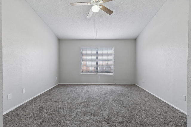 carpeted spare room with ceiling fan and a textured ceiling